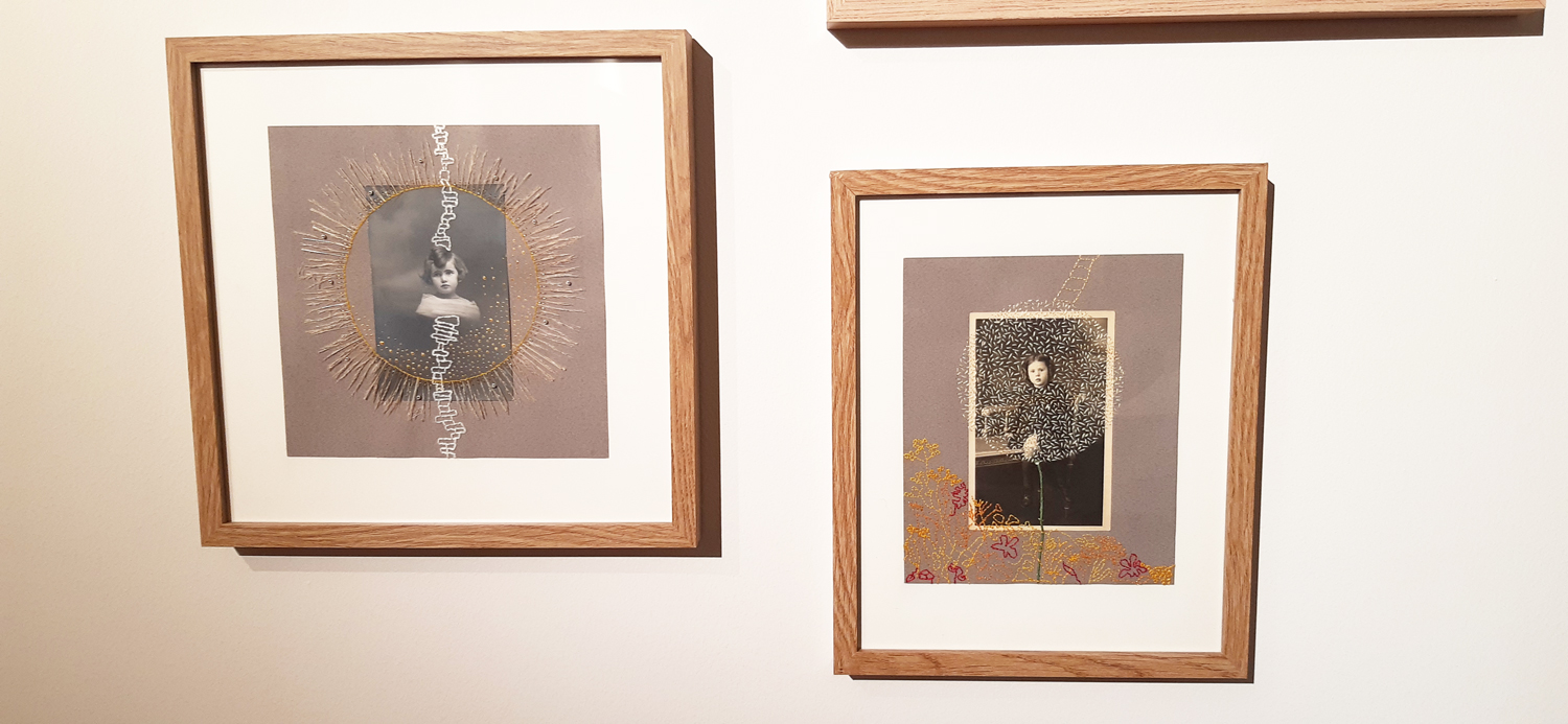 2 photographies anciennes, de portraits de famille, brodées par Sylvie Hénot, encadrées et exposées sur un mur blanc